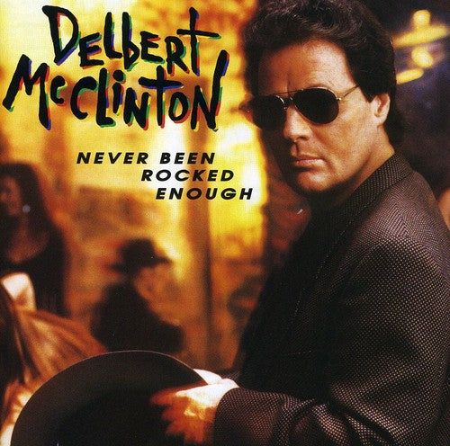 the album cover for Delbert McClinton - Never Been Rocked Enough