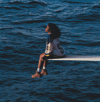 the album cover for SZA - SOS