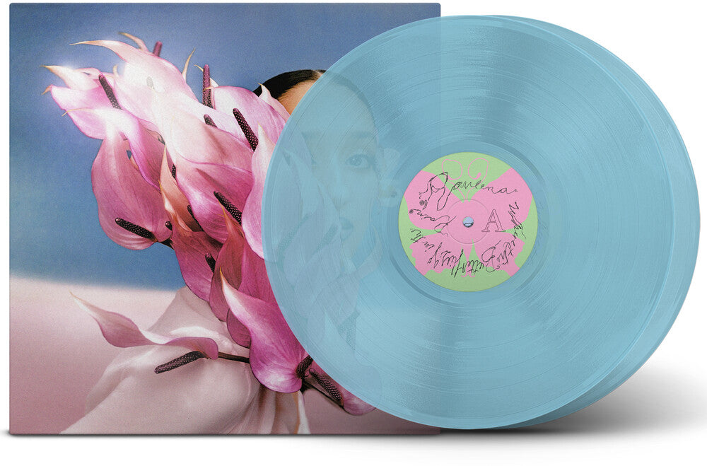 the album cover for Raveena - Where The Butterflies Go In The Rain - Deluxe