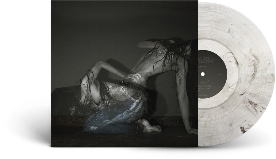 the album cover for Sofia Isella - Something Is A Shell [Indie Exclusive Clear]