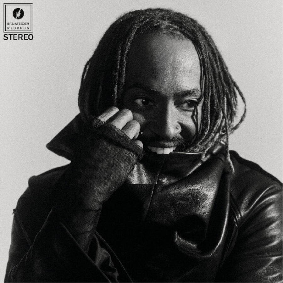 the album cover for Thundercat - Distracted [Indie Exclusive Black Marbled Smoke Effect]