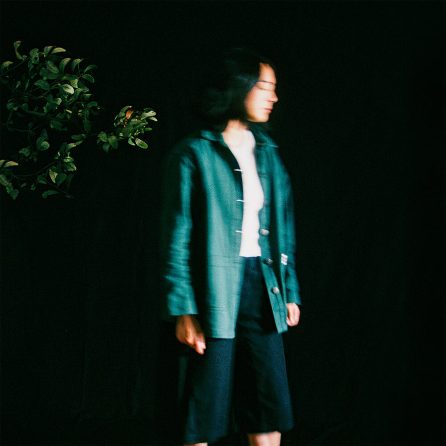 the album cover for Mini Trees - Slow It Down