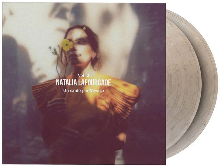 the album cover for Natalia Lafourcade - Un Canto Por Mexico Vol 2 [Crystal Clear and Black Marbled]