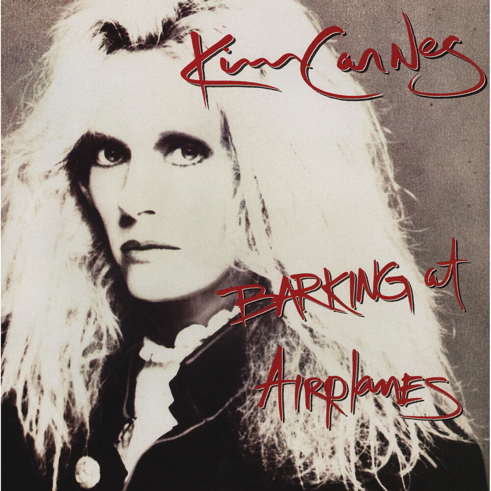 the album cover for Kim Carnes - Barking At Airplanes [With Booklet] (Hol)