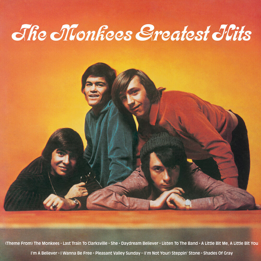 the album cover for Monkees - Greatest Hits (Yellow Flame with Sticker Pack) (Brick & Mortar Exclusive)