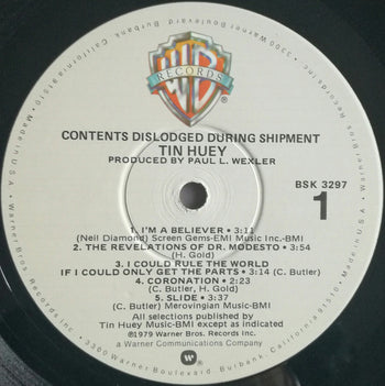 Contents Dislodged During Shipment - Huey, Tin